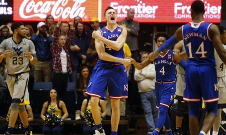In an interesting match, the seventh-ranked Jayhawks team has defeated the Kansas State wildcat by 70-56 points to retain sole possession of the Big 12 lead. During the fast half, Kansas shot the ball great against Kansas State but they played poorly in during the second half.  But soon the team rectified their gameplay style. Svi Mykhailiuk had 22 points to lead four Kansas players in double-figures. Apart from that, Devonte Graham scored 16 points, and Malik Newman scored 13 for Kansas Jayhawks. It was like they all were celebrating the Kansas Day holiday. It was their seventh straight victory over Kansas State. Winning team coach Bill Self said, “If you’re going to be up 13 on the road, have 12 turnovers and go 6 for 13 from the foul line, you wouldn’t think that would be the case.” However, the team managed to keep the lead and win the match by performing good in first half and second half. As per the report Kansas’s forward Mitch Lightfoot suffered from injury as he hit his head hard on the floor while taking charge and after that, for several minutes he stayed down on the floor. But after some time, Lightfoot stood up on his leg and walked off with help. Coach Self said “They said he was fine. I guess he passed the protocol.” Dean Wade who had scored 20 points and eight rebounds said “I don’t think we were in rhythm the whole game. We didn’t get inside enough – there’s a lot of different things that happened that we could have done better.” Bruce Weber, the coach of Kansas State, said “I told the guys we had to play better than we did in Lawrence.” He further stated that Kansas is a great team and they have a better understanding of themselves. The zone defense slowed them down, Graham stated.