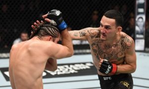 Max Holloway defends the UFC title